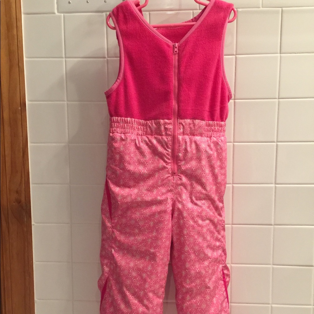 Girls pink Columbia snowsuit with matching coat.